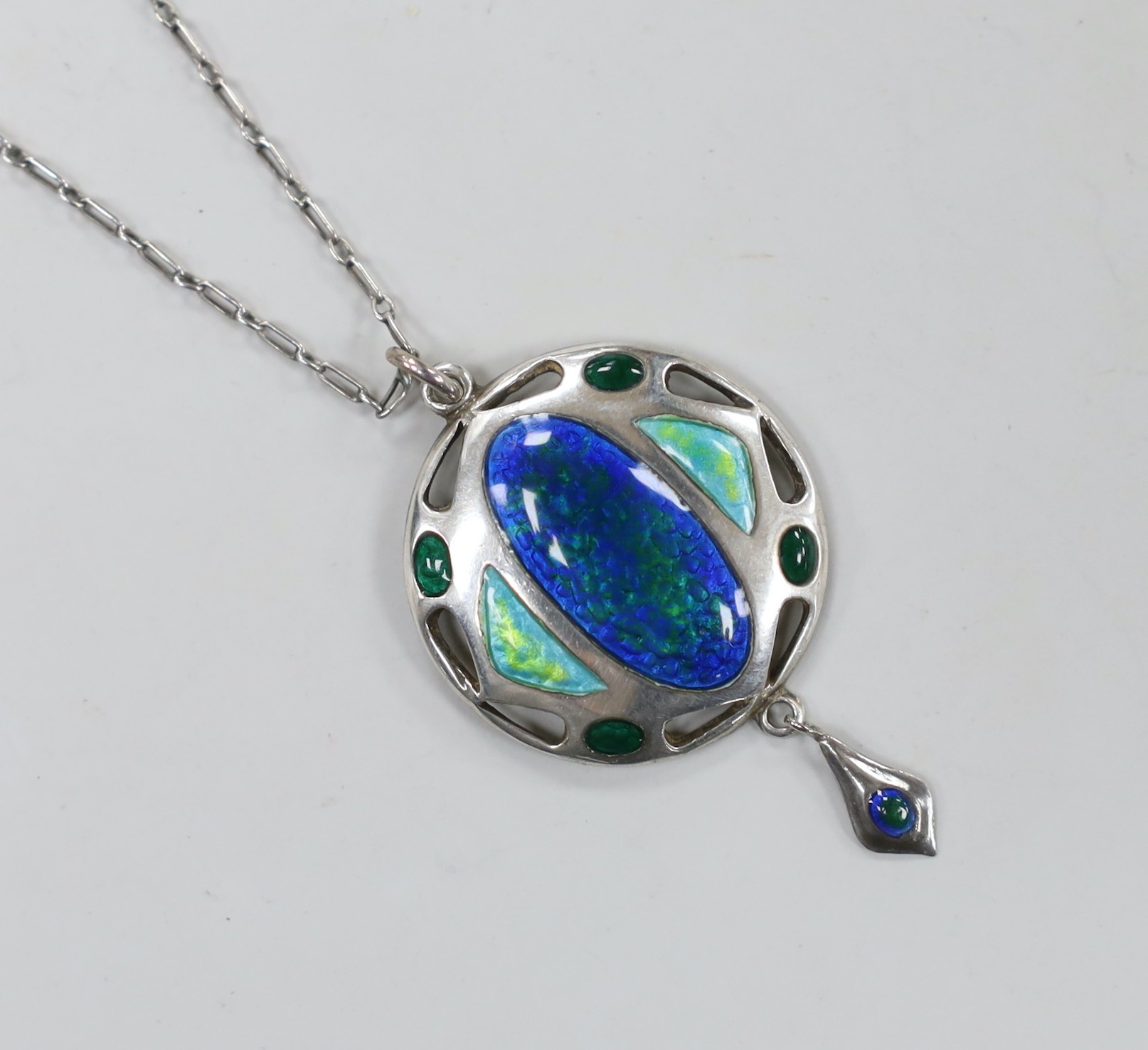 An Edwardian Art Nouveau silver and enamelled drop pendant, Smith & Ewen, Birmingham, 1909, 41mm, on a fine link chain, 42cm.